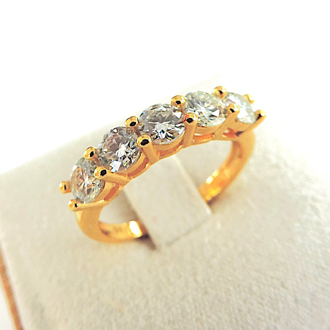 18k Gold 925 Silver Moissanite Gemstone Ring 'New': Title: 18k Gold 925 Silver Moissanite Gemstone Ring 'New' Description: A lovely ring in sterling silver with a 18k yellow gold overlay set with 5 x 3mm sparkling Moissanite gemstones. Ring size
