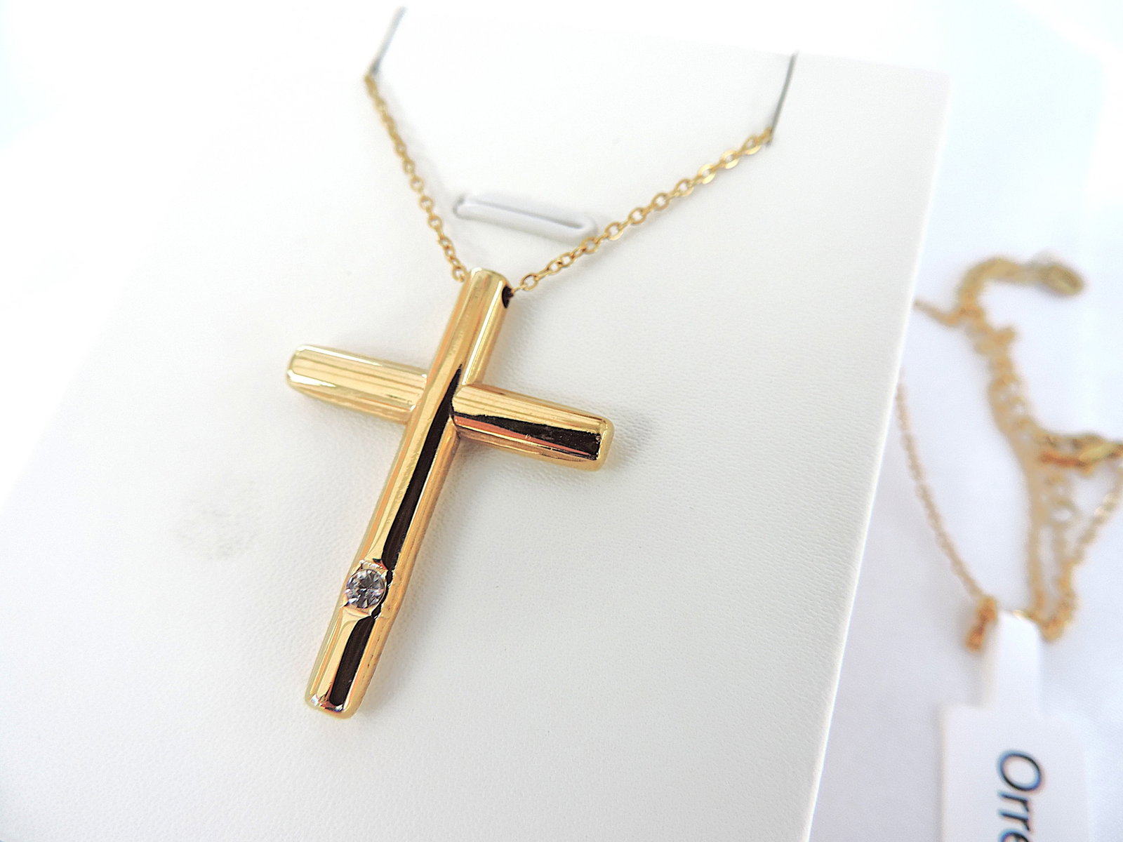 Orrevé Gold Plated CZ Gemstone Cross Pendant Necklace: Title: Orrevé Gold Plated CZ Gemstone Cross Pendant Necklace Description: A fine quality 14k gold plated cross pendant set with a CZ gemstone on an 18 inch 14k gold plated chain. New