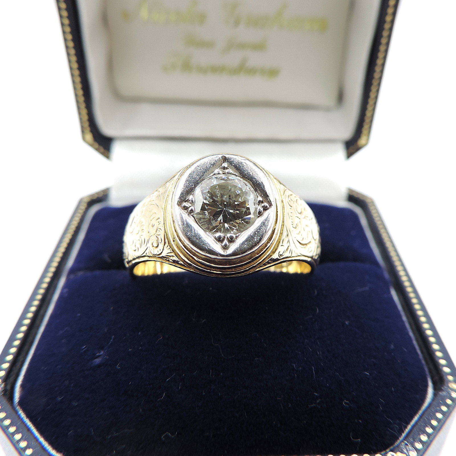 Edwardian 18K Gold Old Mine Cut 1.25 Carat Diamond Ring London Hallmark 1903: Title: Edwardian 18K Gold Old Mine Cut 1.25 Carat Diamond Ring London Hallmark 1903 Description: This striking ring is set to the centre with a large 7mm old mine cut diamond (TCW 1.25). 