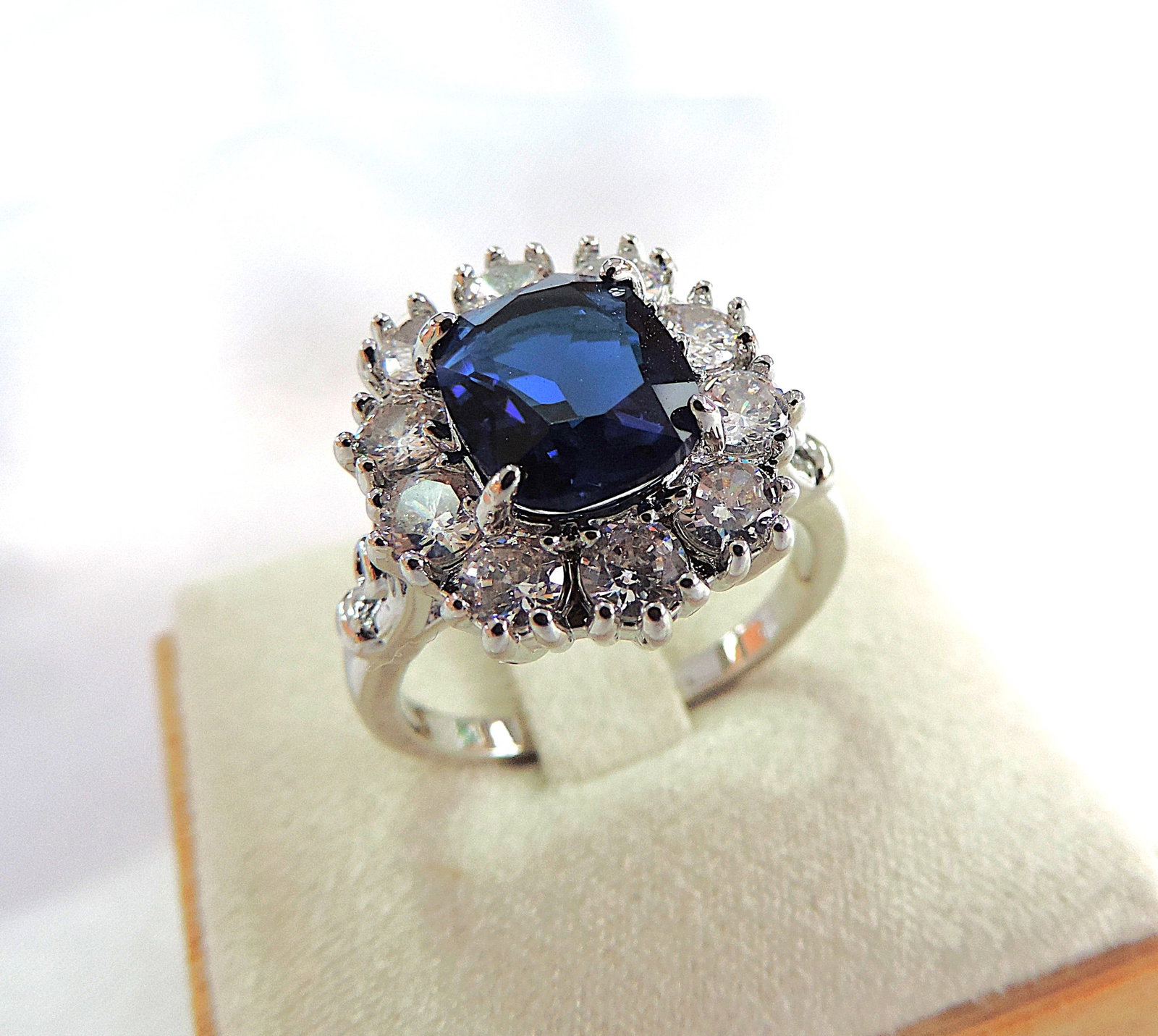 7.5 Carat Blue & White Zircon Gemstone Ring 'New': Title: 7.5 Carat Blue & White Zircon Gemstone Ring 'New' Description: A fabulous ring in silver tone metal set with sparkling Blue & white Zircons. 1 x Emerald cut Blue Zircon 10x7mm