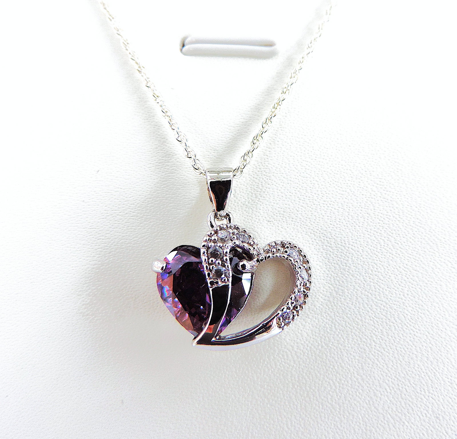 925 Silver Amethyst & Diamond Heart Pendant Necklace: Title: 925 Silver Amethyst & Diamond Heart Pendant Necklace Description: A beautiful pendant in 925 silver set with a hearth shaped Amethyst gemstone with a an overlapping heart set with