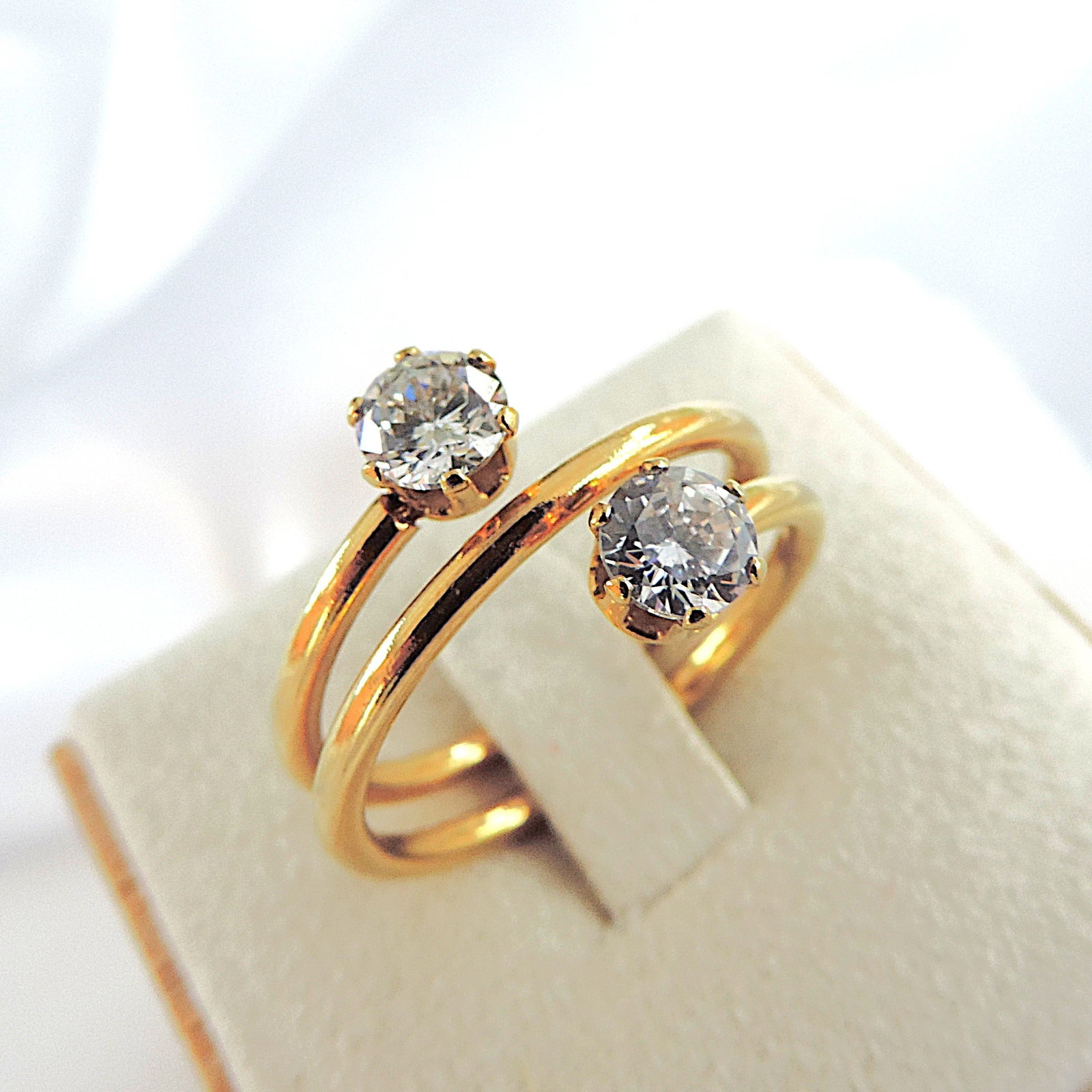 14k Godl On Silver CZ Gemstone Ring: Title: 14k Godl On Silver CZ Gemstone Ring Description: A lovely ring 14k gold on silver set with CZ gemstones. Ring size O Condition: New Delivery option: Collection & Delivery Location: