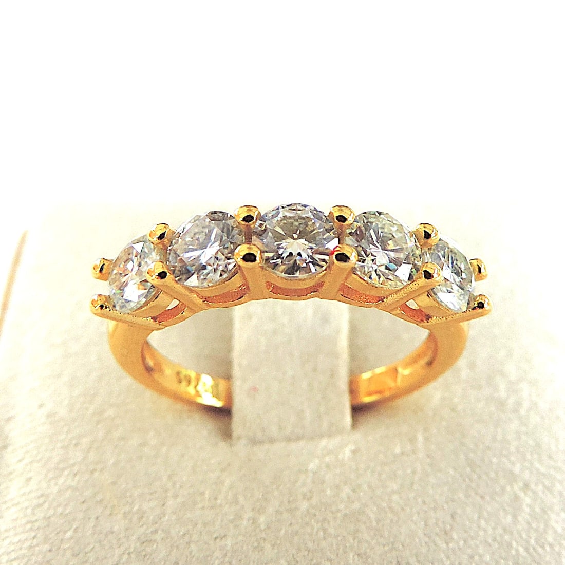 18k Gold 925 Silver Moissanite Gemstone Ring 'New': Title: 18k Gold 925 Silver Moissanite Gemstone Ring 'New' Description: A beautiful ring in 925 silver with an 18k yellow gold overlay set with 5 x 3mm (0.90 TCW) sparkling round Moissanite