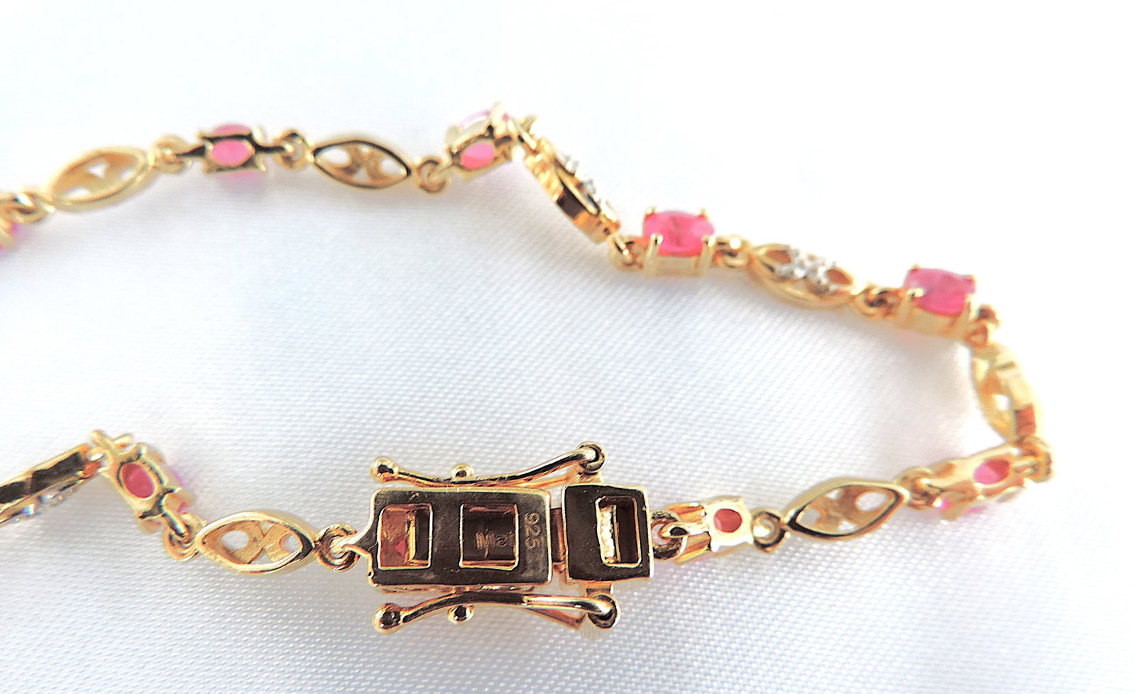18k Gold 925 Silver 3.85 Carat Ruby Bracelet 'New': Title: 18k Gold 925 Silver 3.85 Carat Ruby Bracelet 'New' Description: A beautiful bracelet in 925 silver with an overlay of 18k gold set with 11x 5x3mm (3.85 TCW) Rubies and stamped 925 on clasp.&