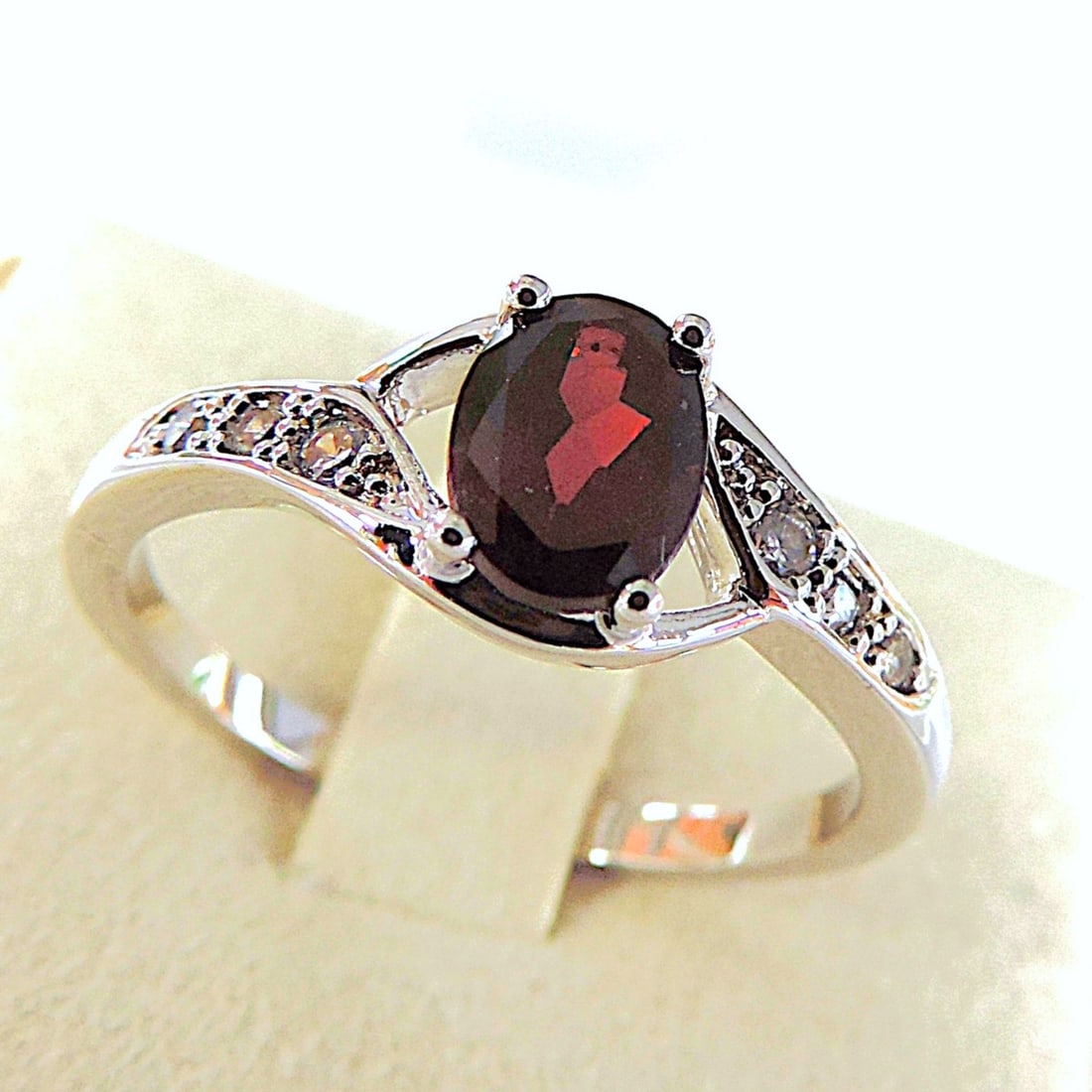 925 Silver Crimson Red Topaz & Diamond Ring 'New': Title: 925 Silver Crimson Red Topaz & Diamond Ring 'New' Description: A beautiful ring in sterling silver set with a 7x5mm (1.10 Carat) Crimson Red Topaz gemstone with 6 x 0.9mm diamonds