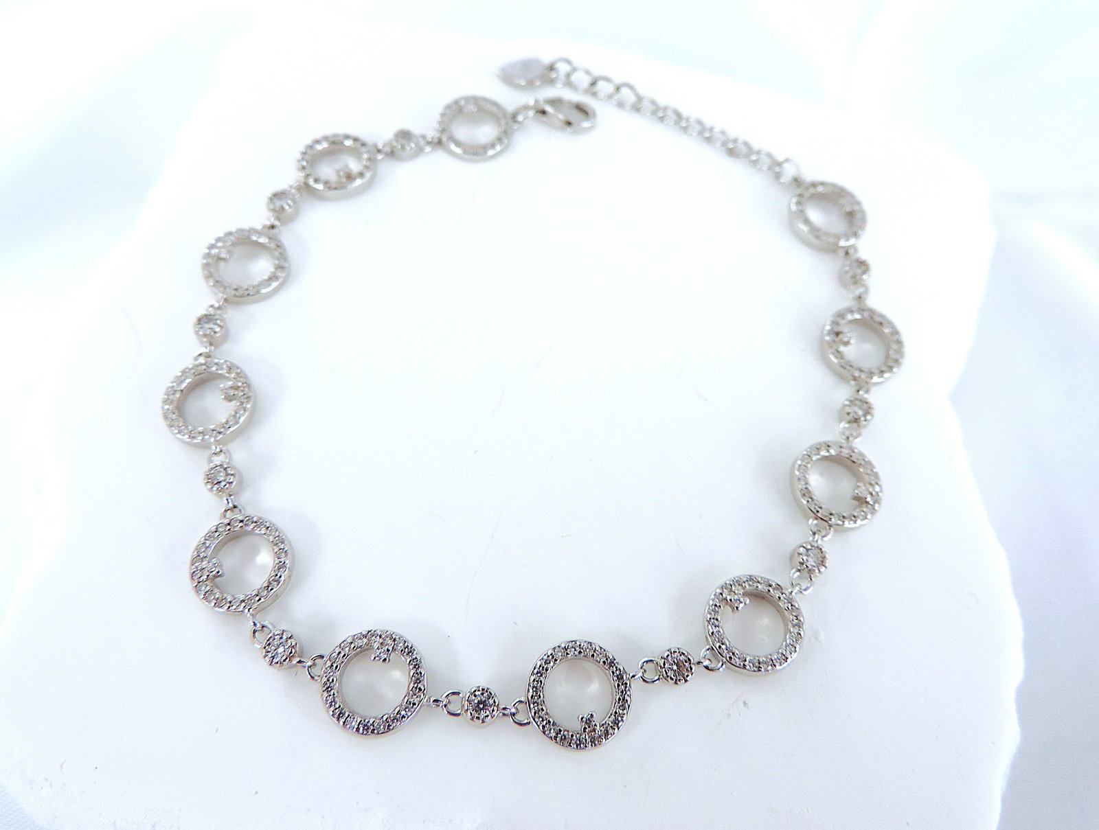 925 Silver White Zircon Gemstone Open Circles Bracelet 'New': Title: 925 Silver White Zircon Gemstone Open Circles Bracelet 'New' Description: A lovely open circles bracelet in 925 sterling silver set with sparkling White Zircon gemstones. Bracelet