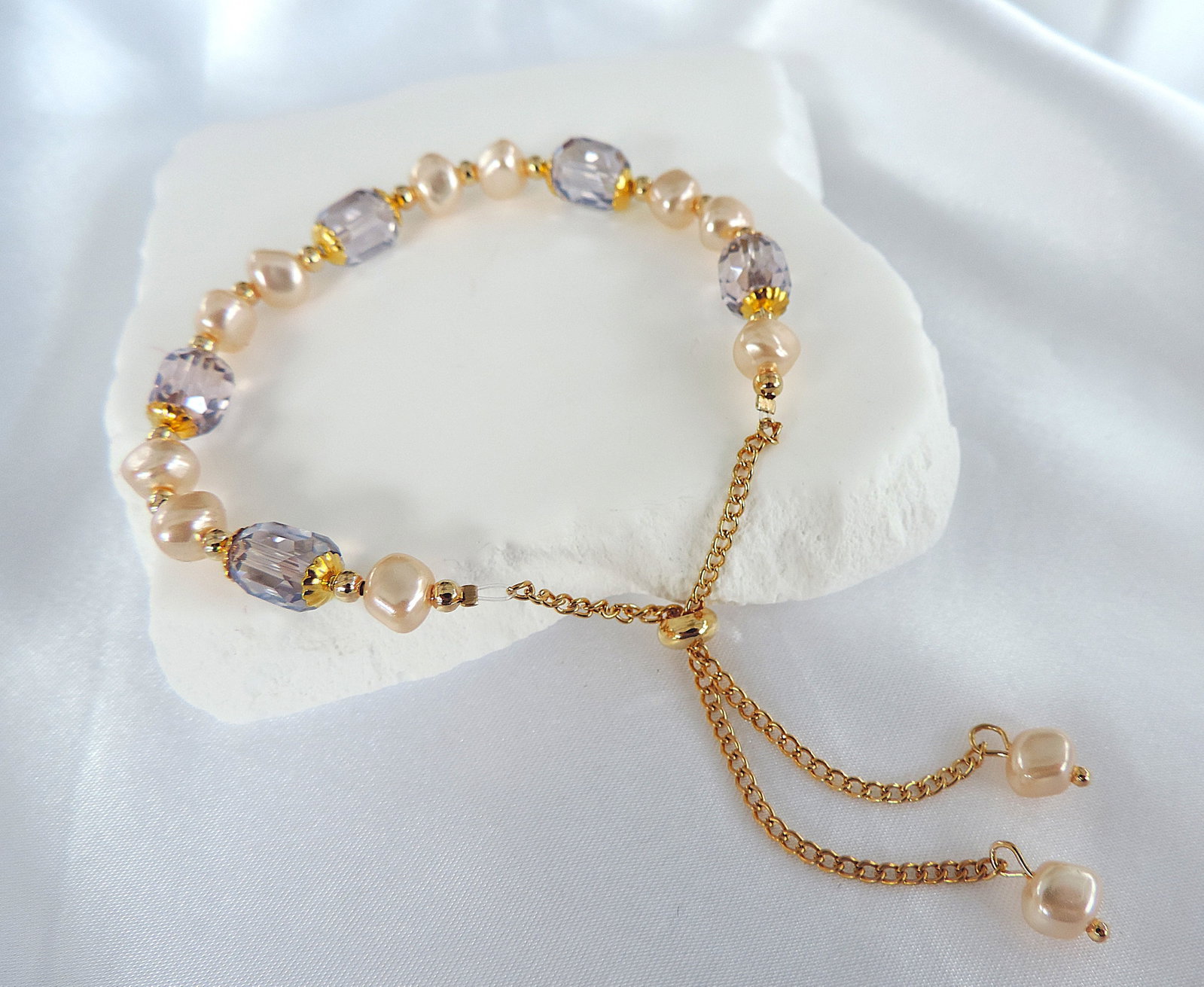 Crystal & Pearl Slider Bracelet 'New': Title: Crystal & Pearl Slider Bracelet 'New' Description: A pretty gold tone metal crystal & faux pearl costume jewellery slider bracelet. New includes a gift pouch. Condition:
