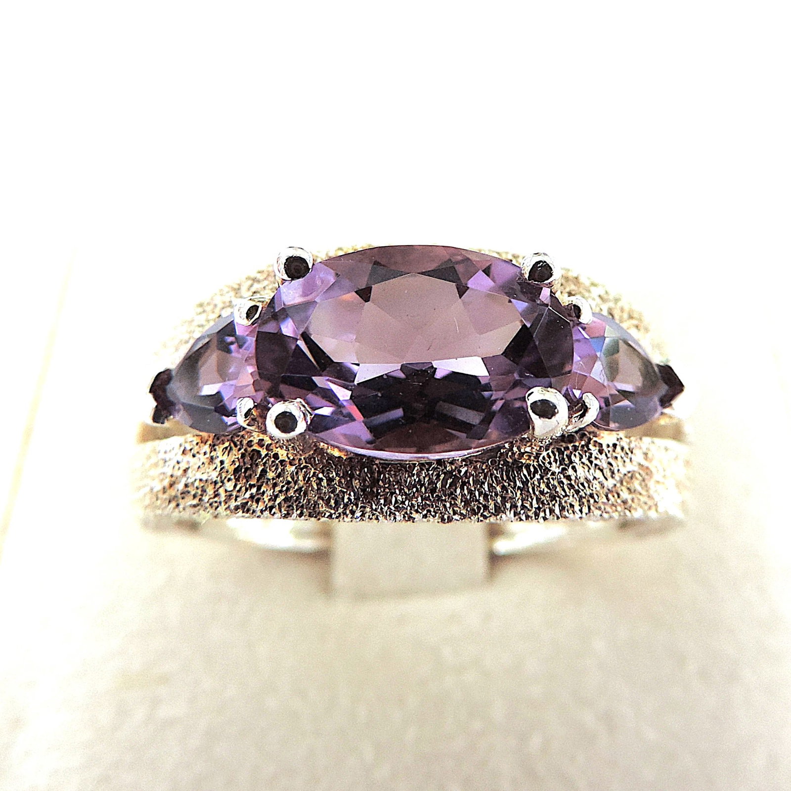 925 Silver Amethyst Gemstone Ring 'New': Title: 925 Silver Amethyst Gemstone Ring 'New' Description: A gorgeous ring in 925 silver with diamond-cut shoulders. The ring is set with 1 x 8 x 6 mm & 2 x 4 x 3mm Amethyst