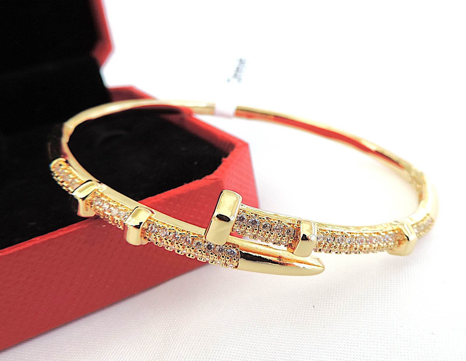 Orrevé 18k Gold Plated Pave Zircon Bangle/Bracelet 'New': Title: Orrevé 18k Gold Plated Pave Zircon Bangle/Bracelet 'New' Description: A gorgeous 'Orrevé Nail Design' 18k gold plated Zircon Pave hinged bangle/bracelet. Includes a gift pouch.