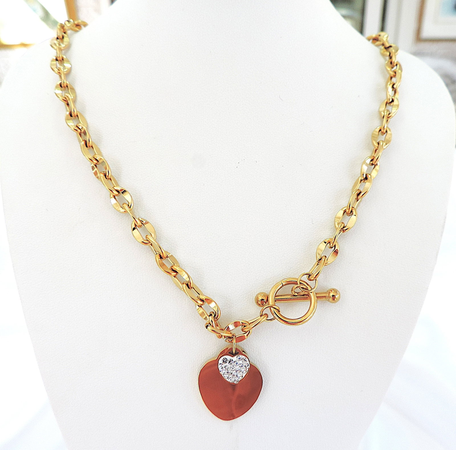 Orrevé Gold Plated Crystal Heart Necklace 'New With Gift Box': Title: Orrevé Gold Plated Crystal Heart Necklace 'New With Gift Box' Description: A gorgeous 18k gold plated costume jewellery toggle heart crystal necklace. Necklace has a wearable length