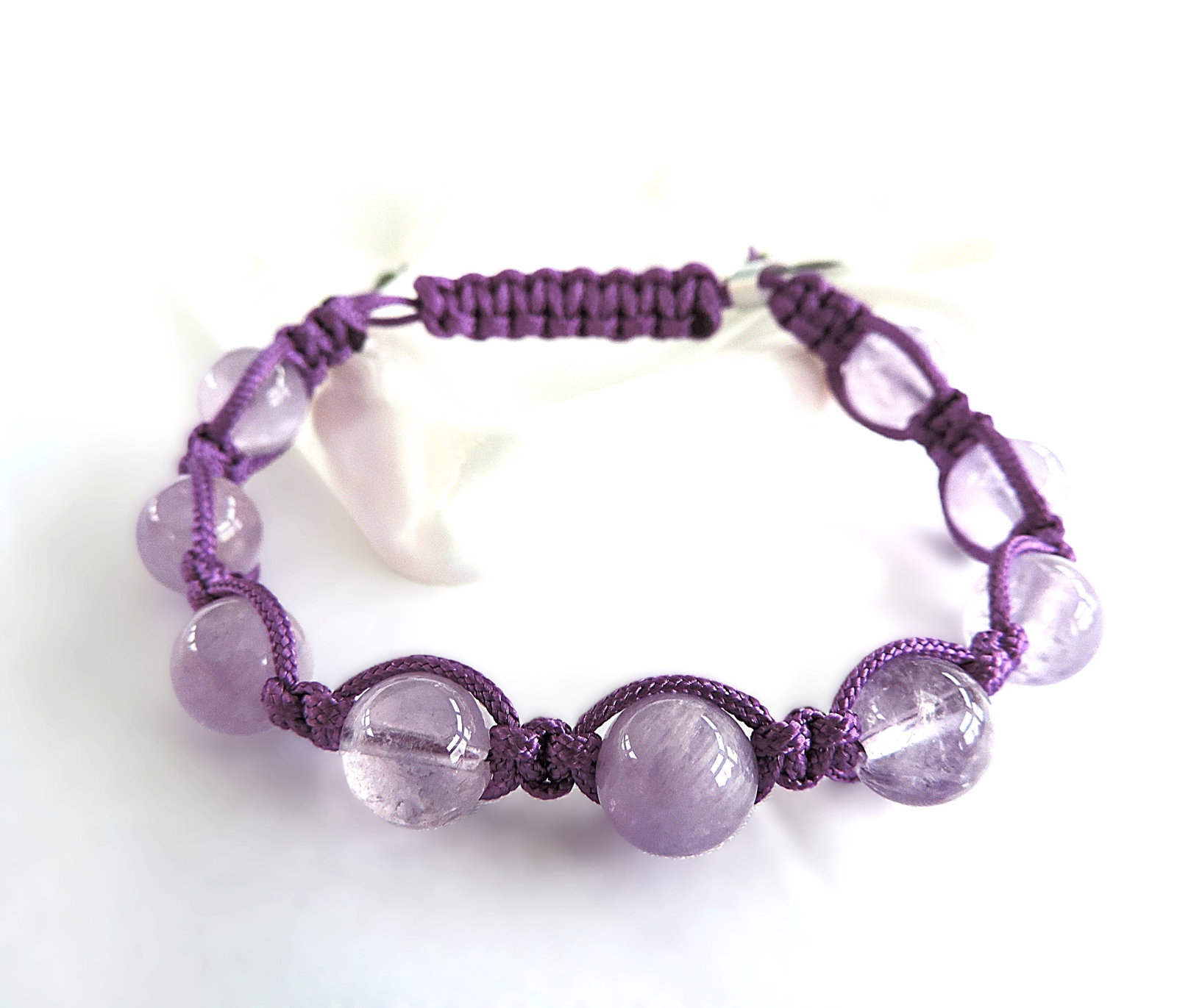 Amethyst Gemstone Bead Friendship Bracelet 'New': Title: Amethyst Gemstone Bead Friendship Bracelet 'New' Description: A lovely bracelet set with Amethyst gemstone beads. Bracelet is adjustable. Includes a gift pouch. Condition: New