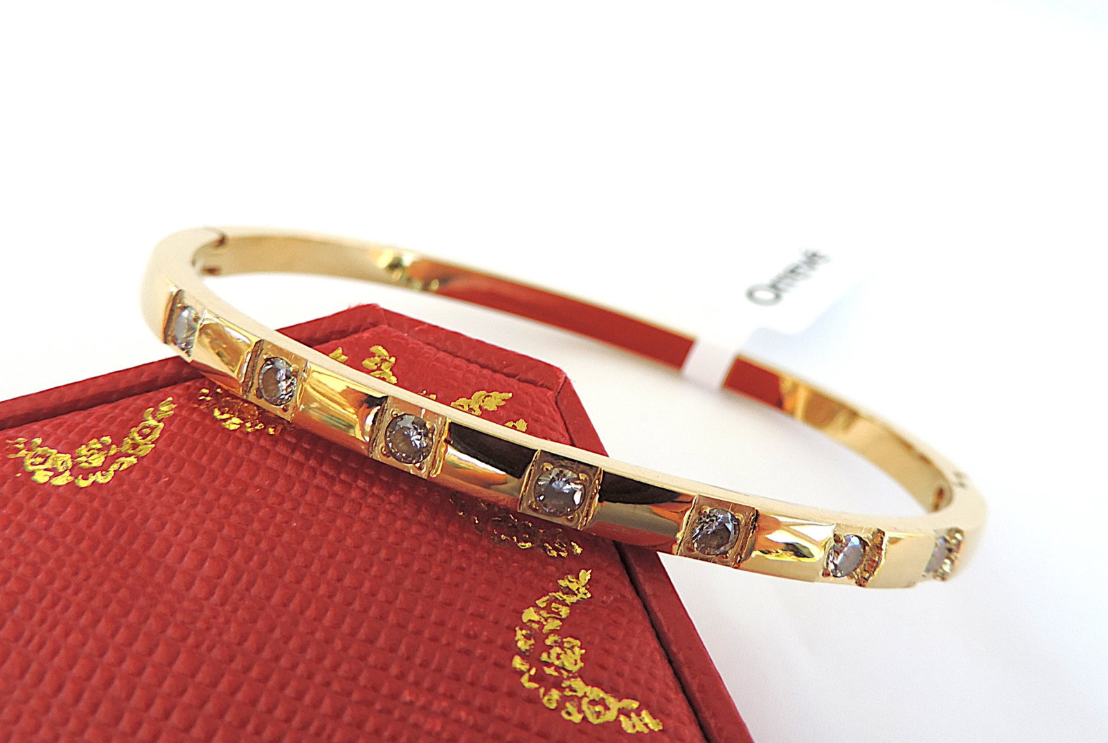 Orrevé 18k Gold Plated White Zircon Gemstone Bracelet 'New': Title: Orrevé 18k Gold Plated White Zircon Gemstone Bracelet 'New' Description: A gorgeous Orrevé 18k gold plated hinged bracelet set with 7 x round sparkling white Zircon gemstones. 