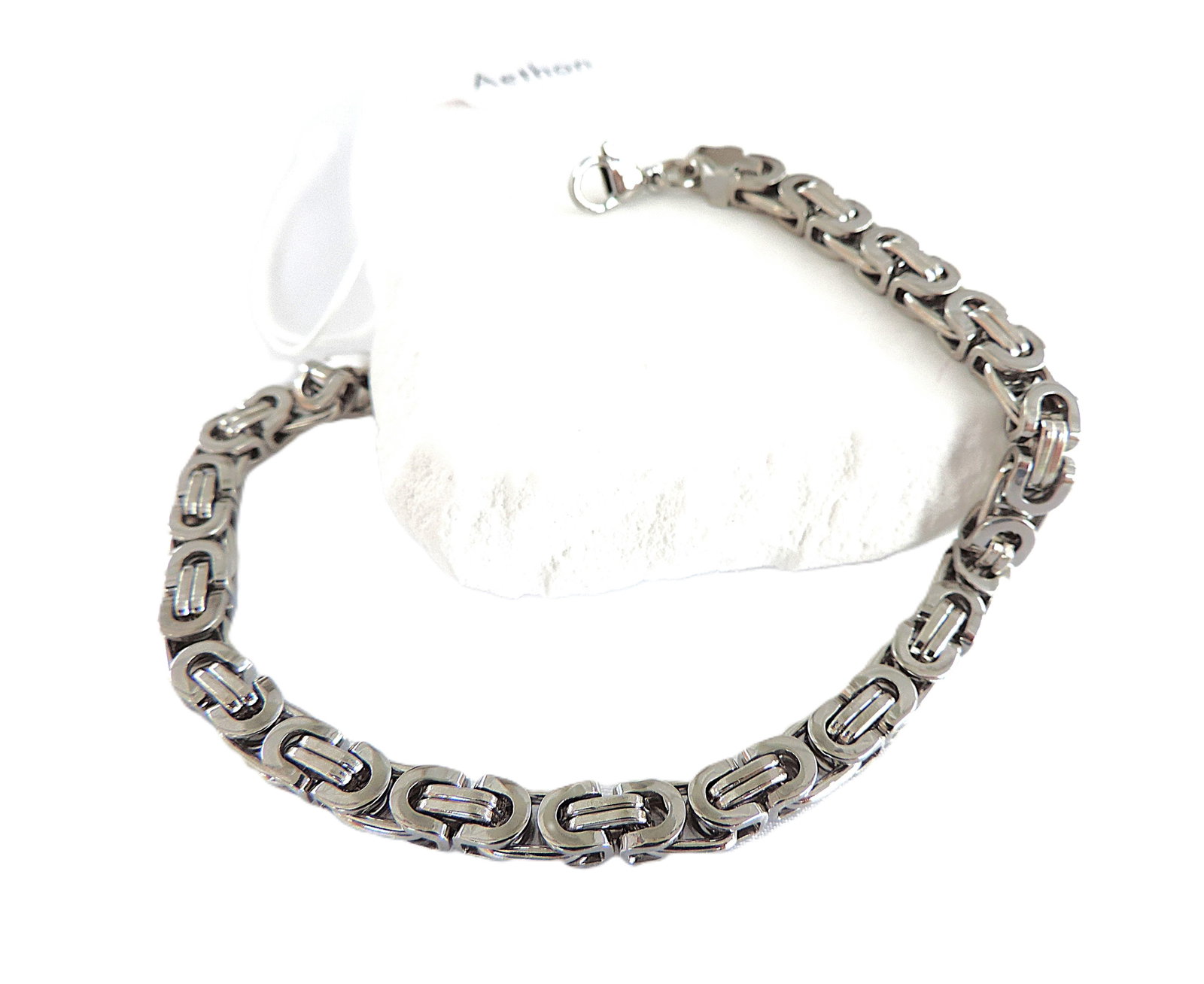 Atheon Stainless Steel Men's Bracelet 'New': Title: Atheon Stainless Steel Men's Bracelet 'New' Description: A sleek and versatile Atheon contemporary stainless steel bracelet. Measurements: 8.5 inches long (21.50 cm) and 1cm wide. (Part