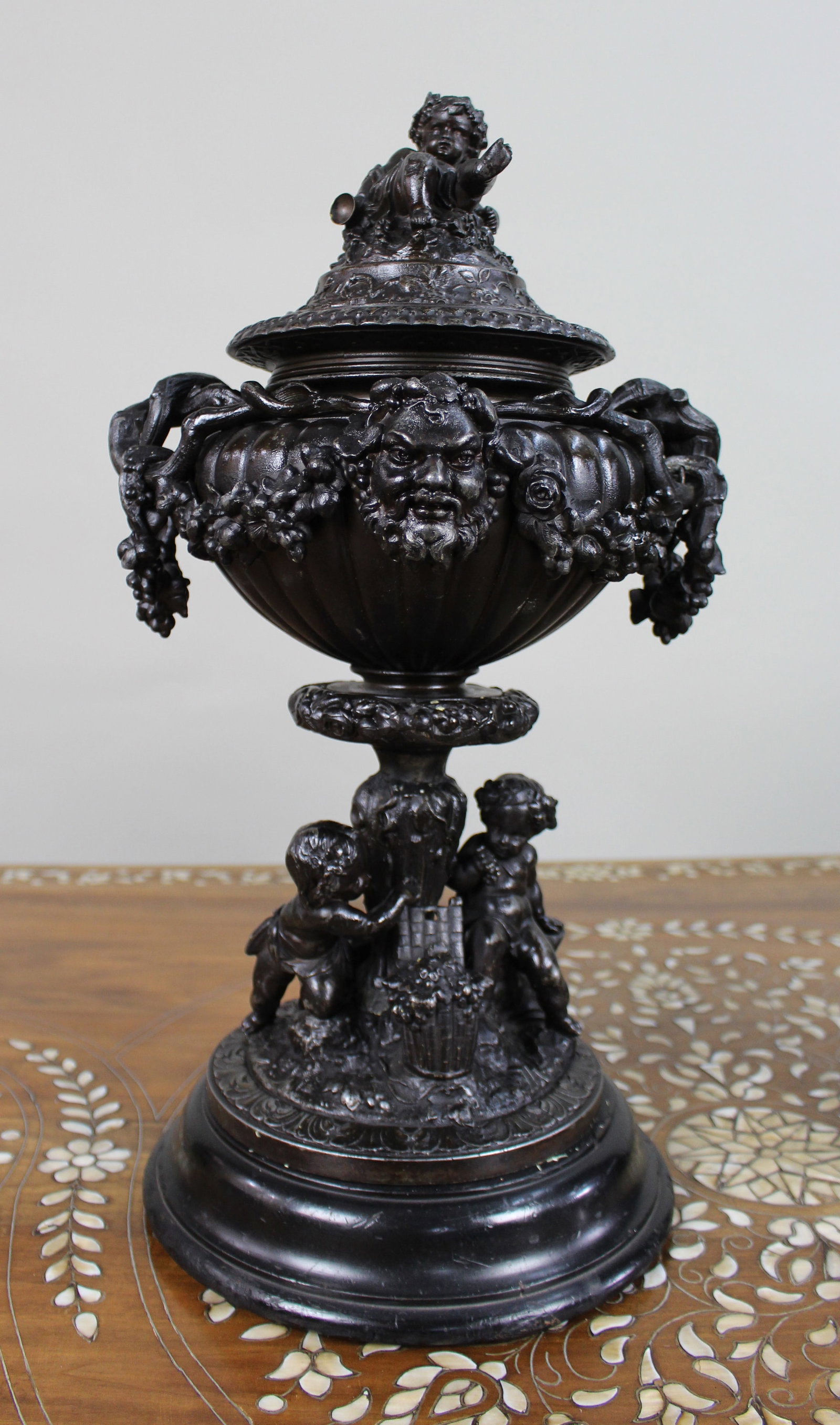Pair of French Bronzed Spelter Urns with Bacchic Masks and Putti, Circa 1880 - 2