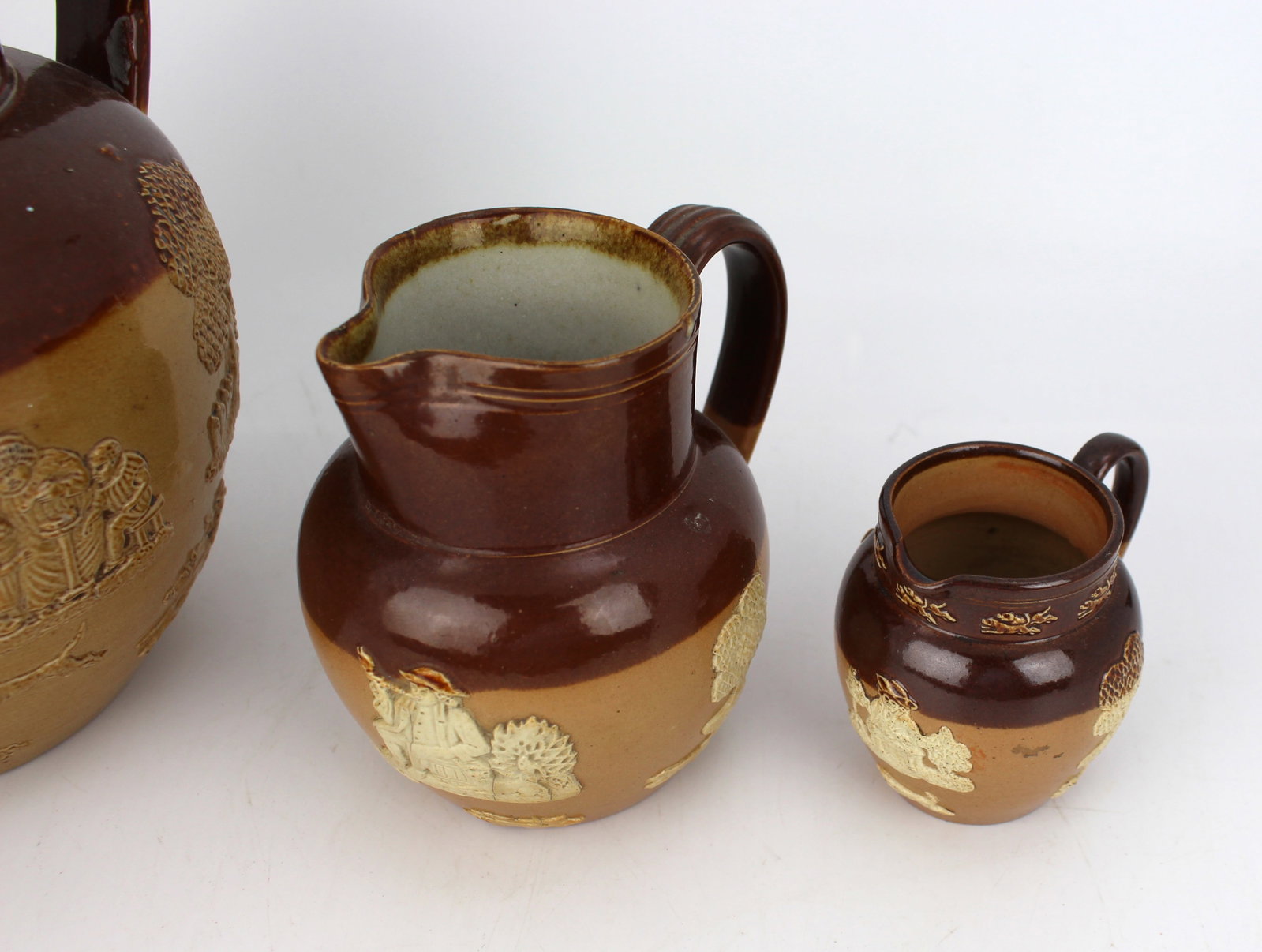 Collection of Three Graduated Doulton Lambeth Stoneware Jugs, c.1900 - 13