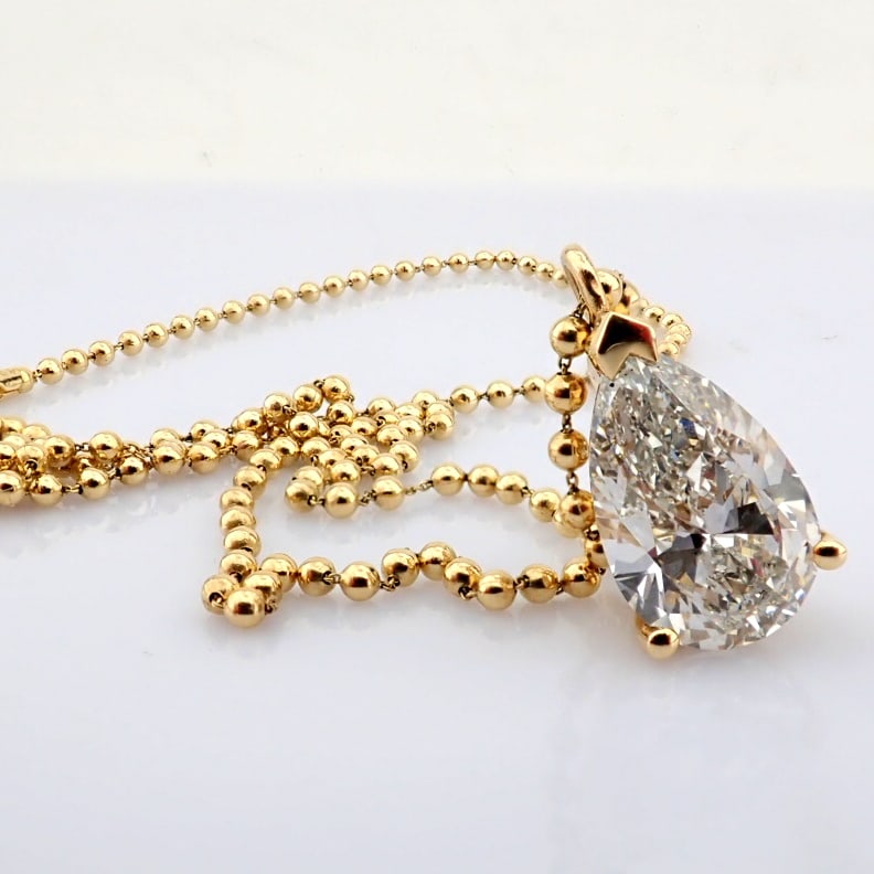 Pear Cut Lab-Grown Diamond Necklace - 6 Total Carat (IGI Certified): Title: Pear Cut Lab-Grown Diamond Necklace - 6 Total Carat (IGI Certified) Description: -------------------------------------------------- METALS AND WEIGHTS : -14K Yellow Gold 7.42 gr