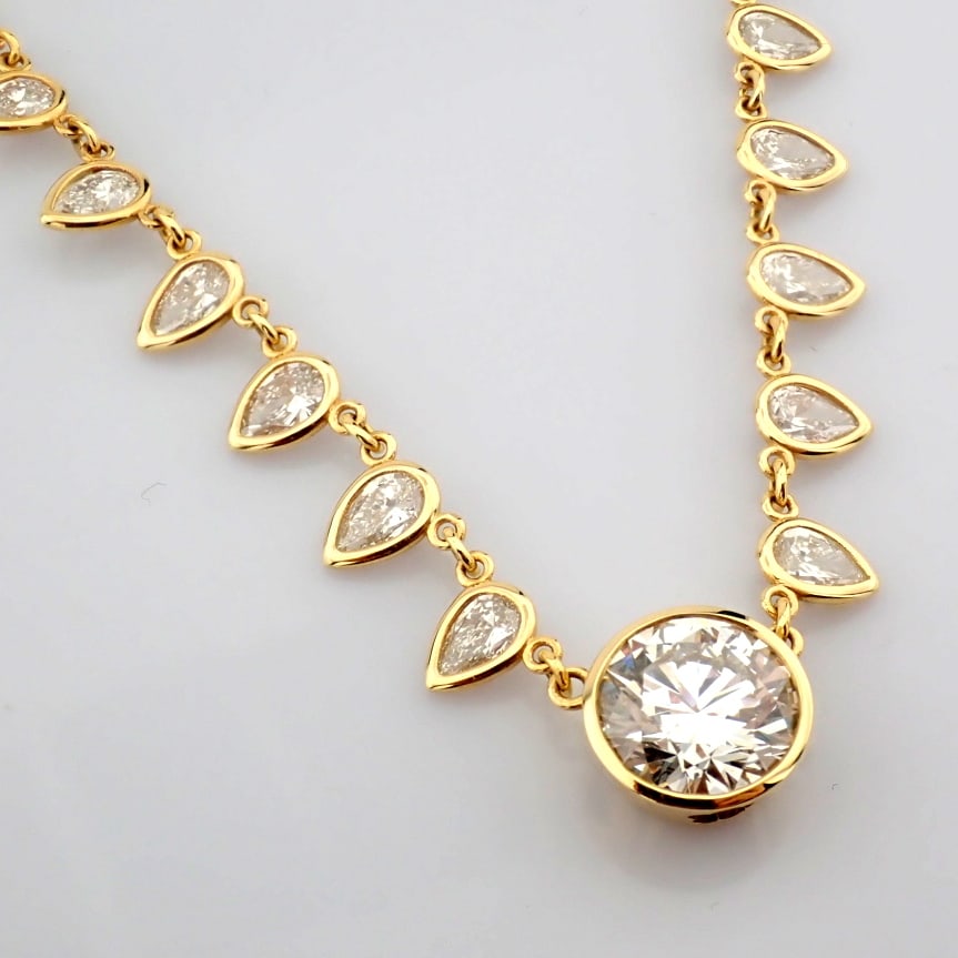 Round Cut Lab-Grown Diamond Necklace - 12.83 Total Carat (IGI Certified): Title: Round Cut Lab-Grown Diamond Necklace - 12.83 Total Carat (IGI Certified) Description: -------------------------------------------------- METALS AND WEIGHTS : -14K Yellow Gold 10.49 gr