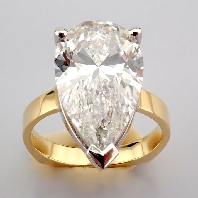 Pear Cut Lab-Grown Diamond Ring - 7.06 Total Carat (IGI Certified): Title: Pear Cut Lab-Grown Diamond Ring - 7.06 Total Carat (IGI Certified) Description: -------------------------------------------------- METALS AND WEIGHTS : -14K Yellow/White Gold 5.63 gr