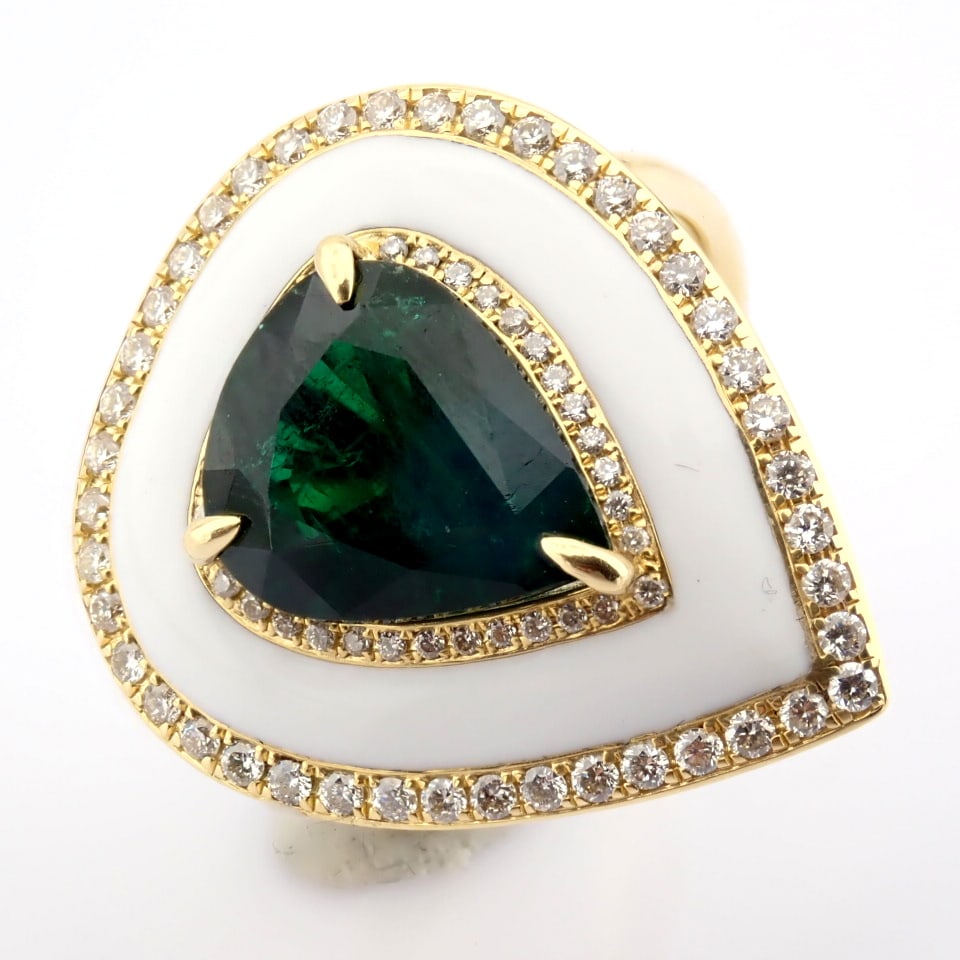 Natural Diamond 18K Yellow Gold Ring: Title: Natural Diamond 18K Yellow Gold Ring Description: A luxurious gold ring featuring white laser enamel, elegantly adorned with vibrant Emerald and brilliant diamonds. ----------------