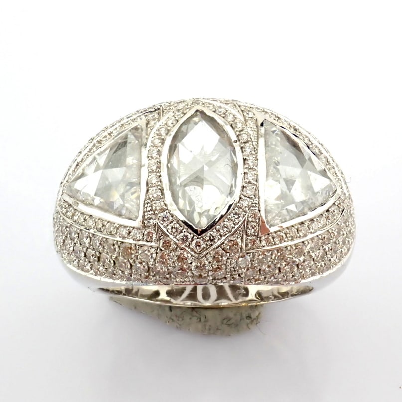 Natural Diamond 18K White Gold Ring: Title: Natural Diamond 18K White Gold Ring Description: A luxurious 18k white gold ring detailed with a slightly flawed fancy cut diamonds. Total 5.06 carat --------------------------------