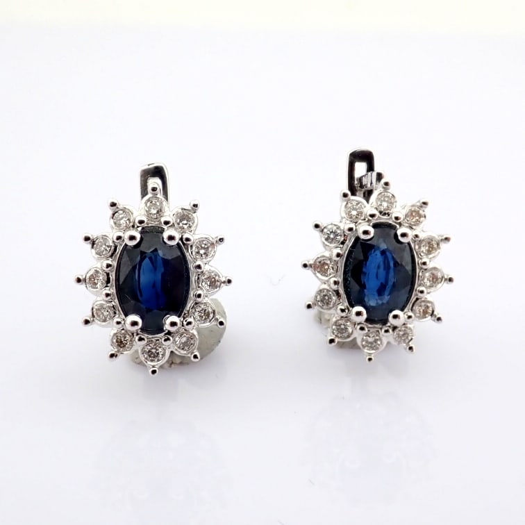 Natural Diamond 18K White Gold Earring: Title: Natural Diamond 18K White Gold Earring Description: 18K white gold cluster earrings detailed with sapphire and brilliant diamonds -------------------------------------------------- •