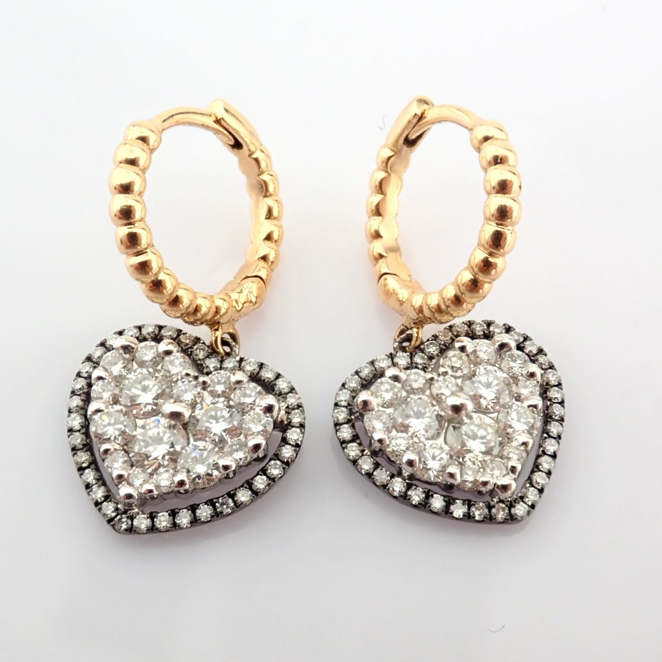Natural Diamond 18K Yellow & White Gold Earring: Title: Natural Diamond 18K Yellow & White Gold Earring Description: 18K yellow and white gold heart earrings detailed with brilliant diamonds --------------------------------------------------
