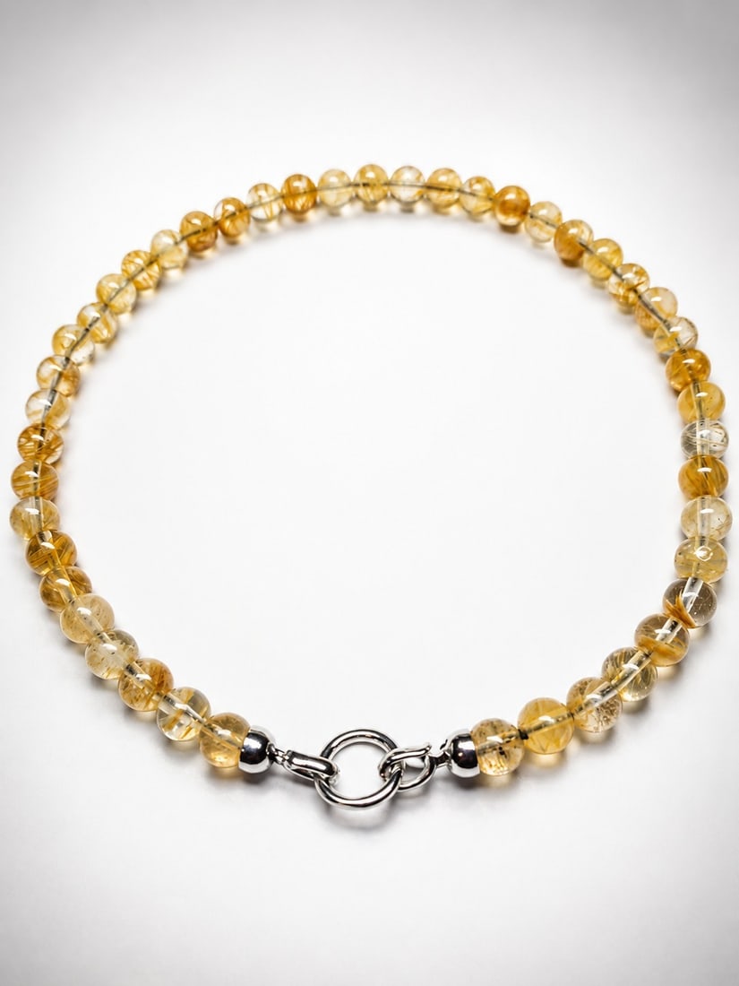 Natural Citrine Bead Necklace: Title: Natural Citrine Bead Necklace Description: Elegant necklace featuring genuine citrine round beads in warm golden-yellow tones. The beads display attractive natural color variations, creating a