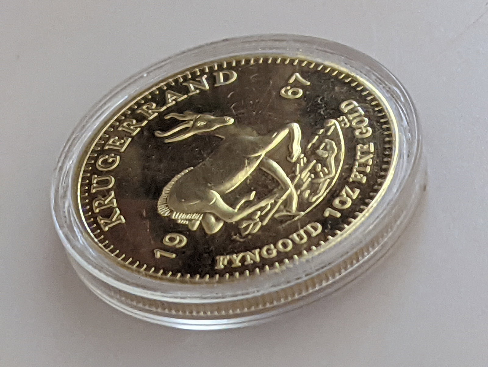 1967 Krugerrand Commemorative Coin – First Year of Issue – Gold Plated: Title: 1967 Krugerrand Commemorative Coin – First Year of Issue – Gold Plated Description: A striking commemorative gold-plated replica of the historic 1967 South African Krugerrand