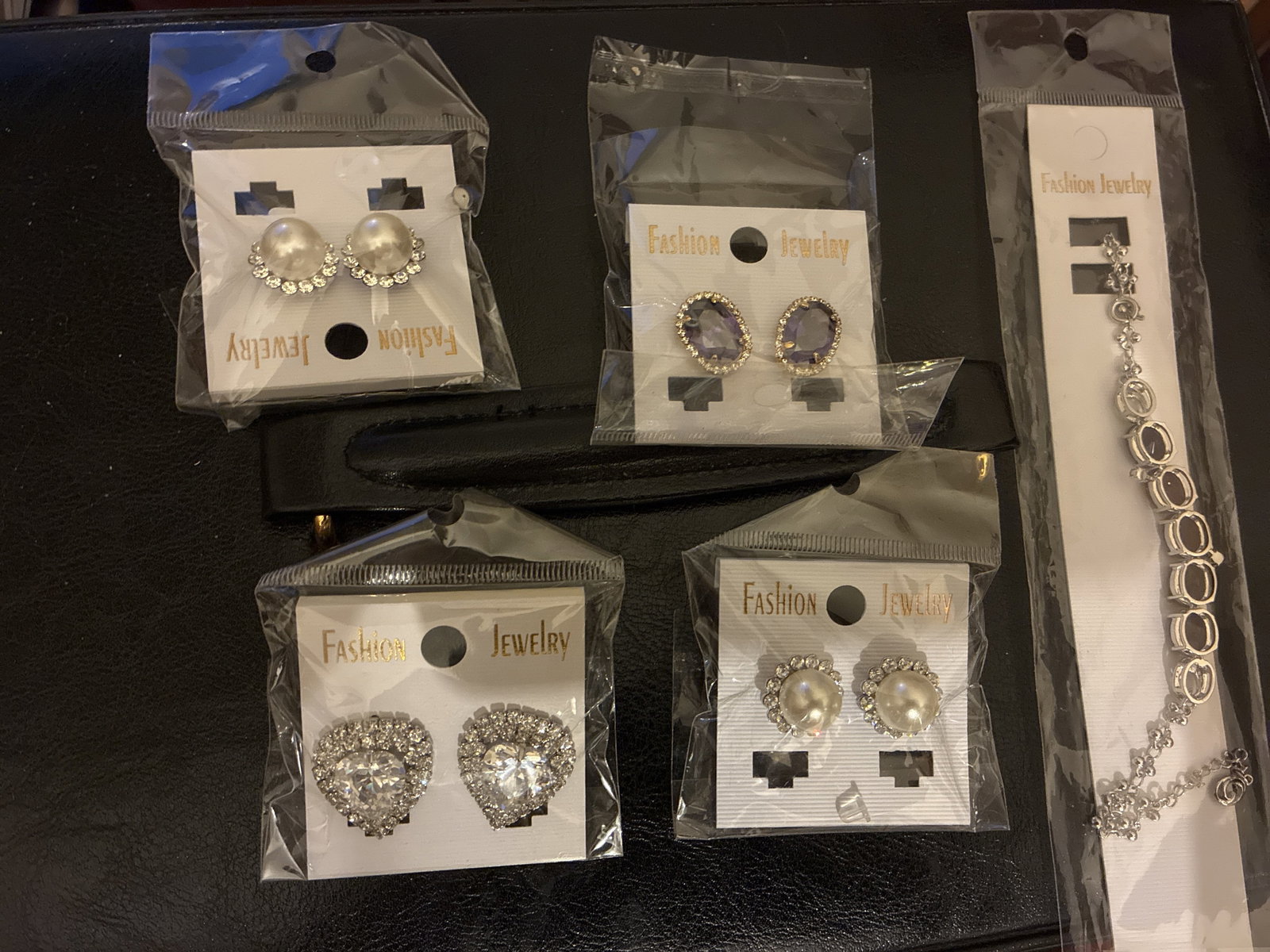 New jewellery: Title: New jewellery Description: 3 pairs of earrings for pierced ears, 1 clip on earrings and bracelet. Uk postage is £6. Condition: New<