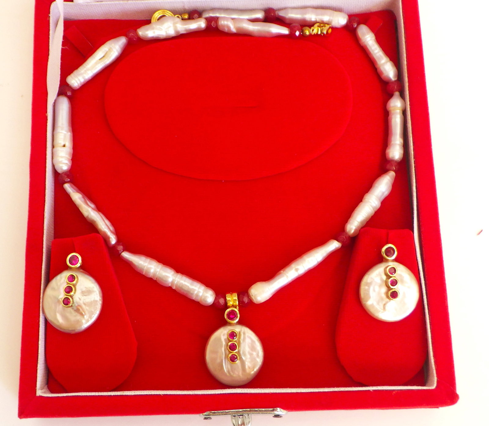 Boxed necklace & earrings set with natural long pearls & rubies: Title: Boxed necklace & earrings set with natural long pearls & rubies Description: A fine, large elongate pearls with round flat pearl accents and adorned with rubies necklace and earrings
