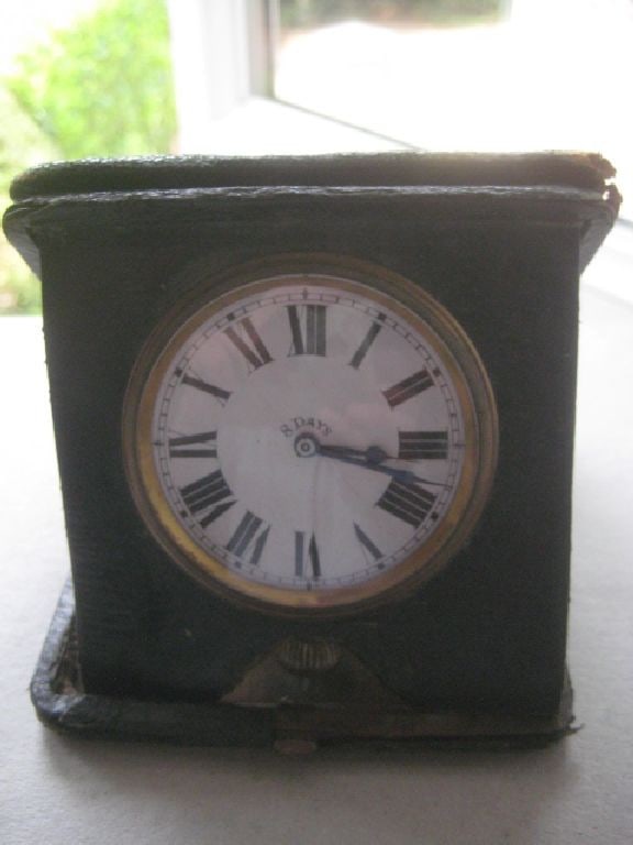 Vintage Swiss Made 8 Day Green Leather Travel Clock: Title: Vintage Swiss Made 8 Day Green Leather Travel Clock Description: Vintage Green Leather Cased 8 Day Travel Clock. Length is 3.5 Inches. Condition: Good. General wear to the leather case. Clock