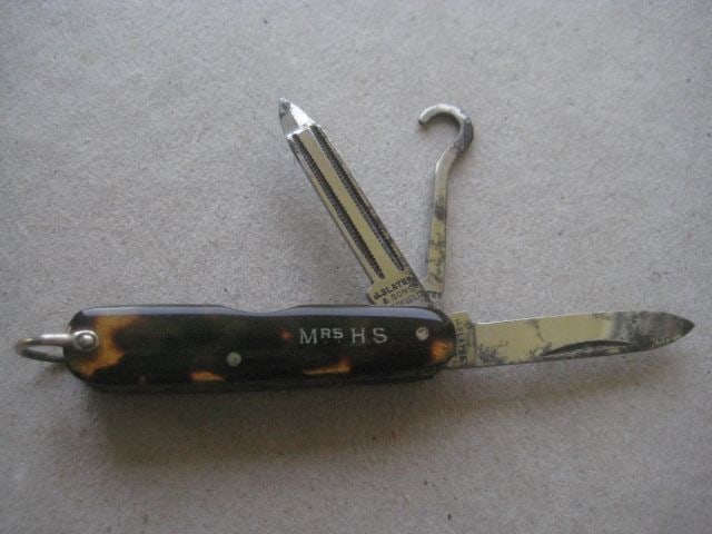 Antique Multibladed Penknife, c1900: Title: Antique Multibladed Penknife, c1900 Description: Antique Multi-Bladed Penknife. The knife has three steel blades. The Knife front is embossed with MRS HS on it. 
