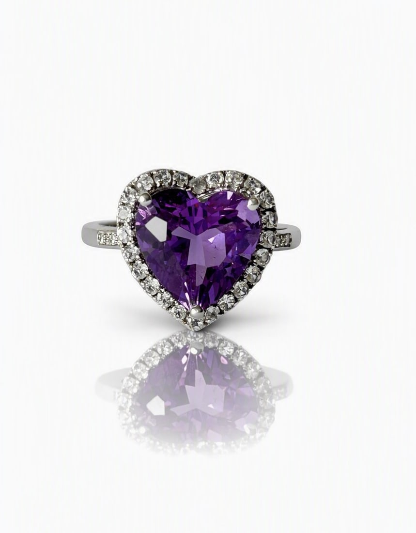 9K White Gold, Diamond, Synthetic Amethyst Ring: Title: 9K White Gold, Diamond, Synthetic Amethyst Ring Description: A 9K white gold synthetic heart shaped amethyst and natural diamond ring (tested) Approx 0.25cts diamonds, good colour and