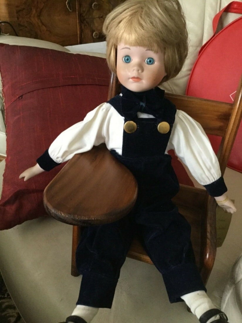 Andrew Schofield Victorian Doll Sitting On A Very Cute Wooden Chair: Title: Andrew Schofield Victorian Doll Sitting On A Very Cute Wooden Chair Description: This is a great porcelain vintage doll sitting on a solid wooden old type school chair. 16" high A