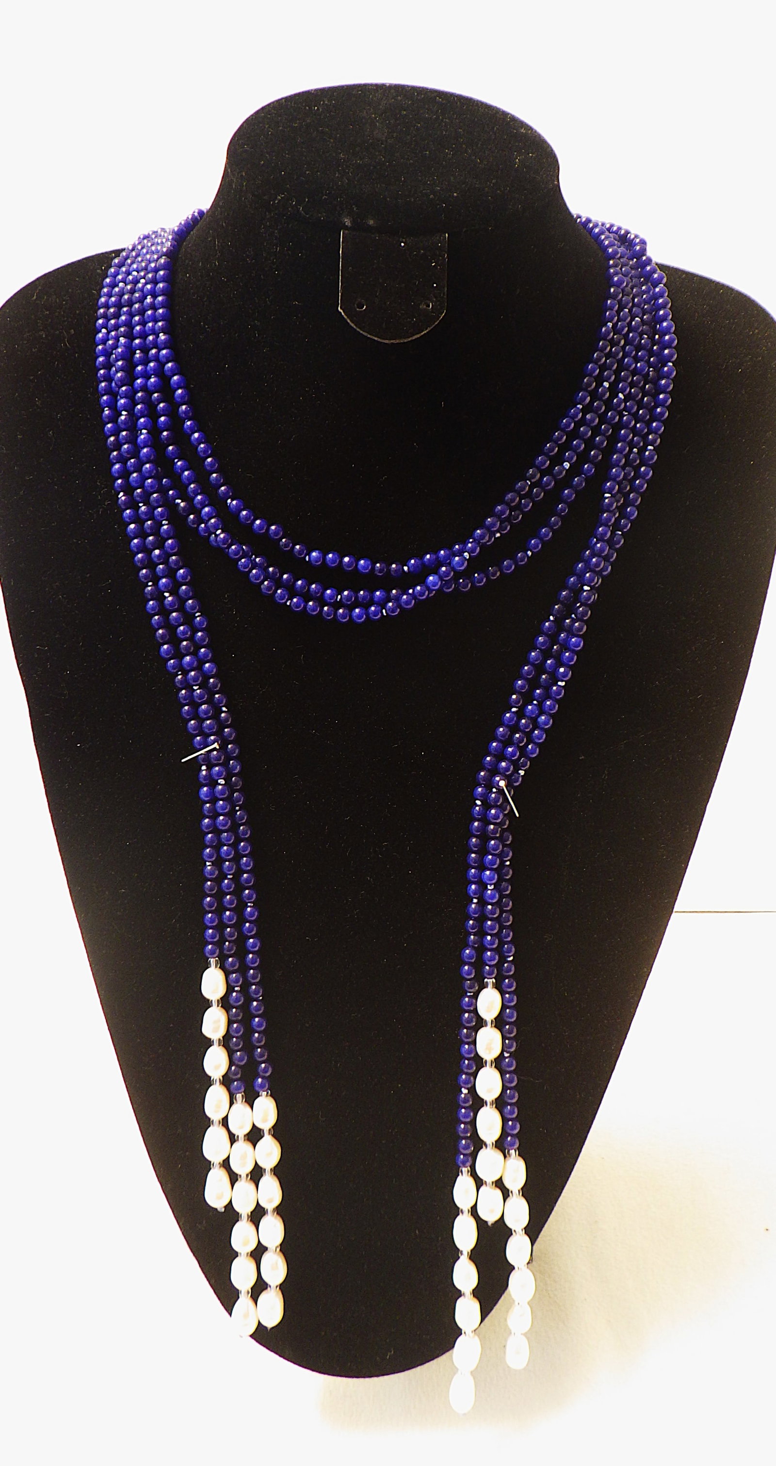 Three long row necklace with blue onyx and natural pearls.: Title: Three long row necklace with blue onyx and natural pearls. Description: A vey unusual and highly fashionable lariat* necklace consisting of three very long (125 cm) strands of natural white
