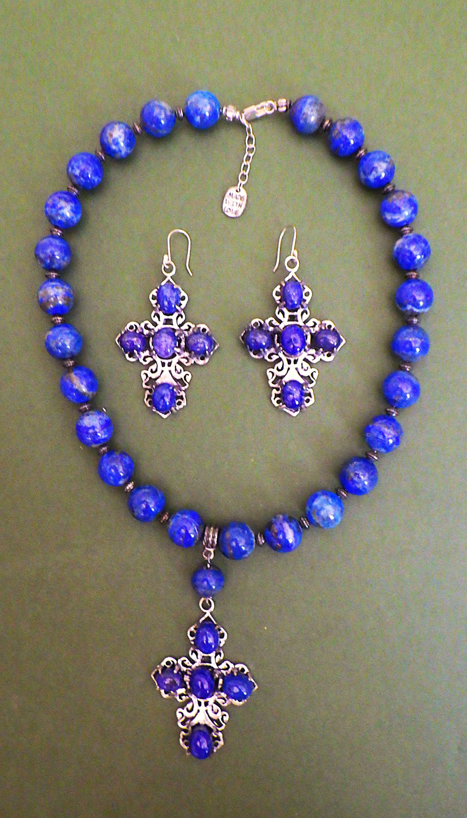 Lapis lazuli necklace & earrings set with large cross pendants.: Title: Lapis lazuli necklace & earrings set with large cross pendants. Description: A uniquely created natural, untreated, lapis lazuli necklace and earrings set with large (5 cm) white metal