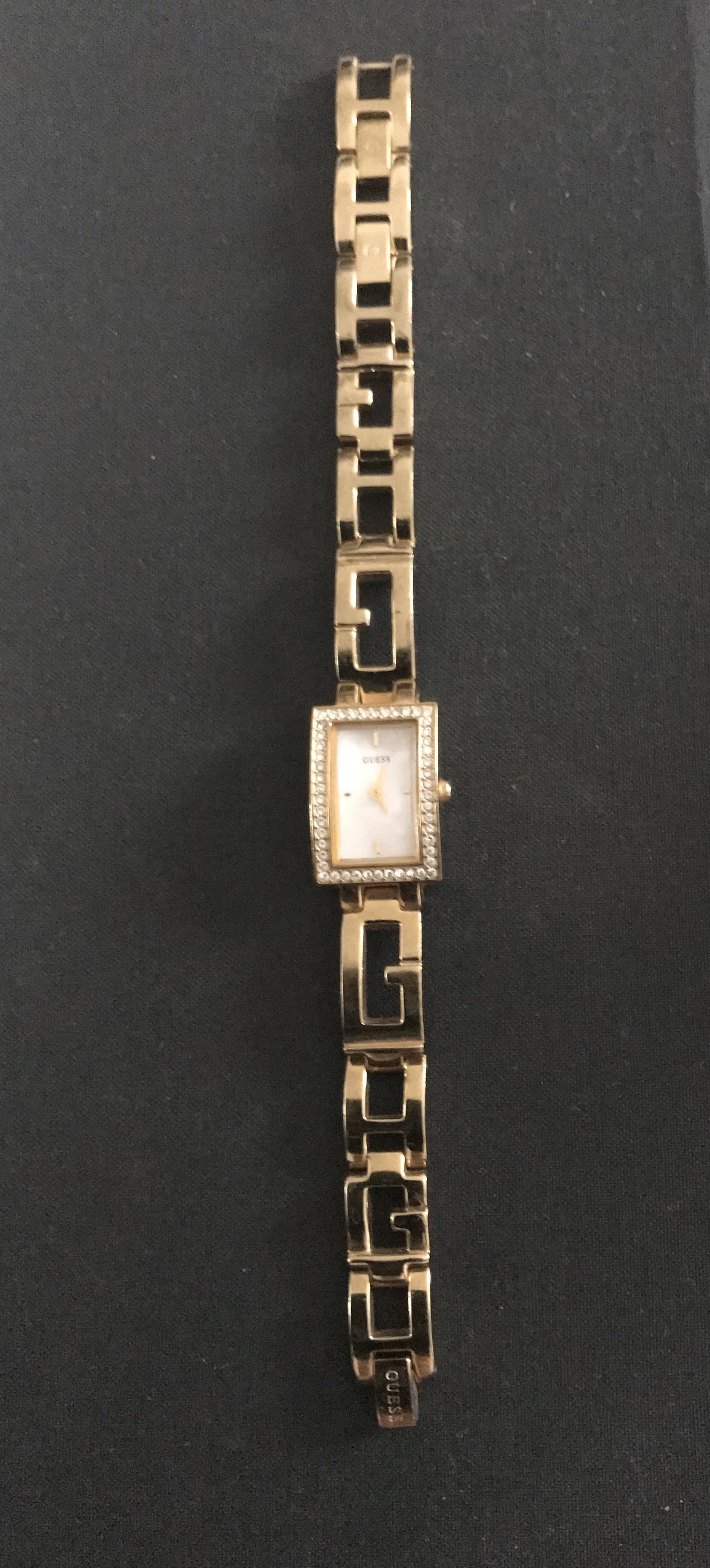 Guess Gold Plated Diamanté Studded Watch: Title: Guess Gold Plated Diamanté Studded Watch Description: Original Vintage Guess Gold Watch. Mother of Pearl dial with rhinestone embellishments. G link strap with rhinestone