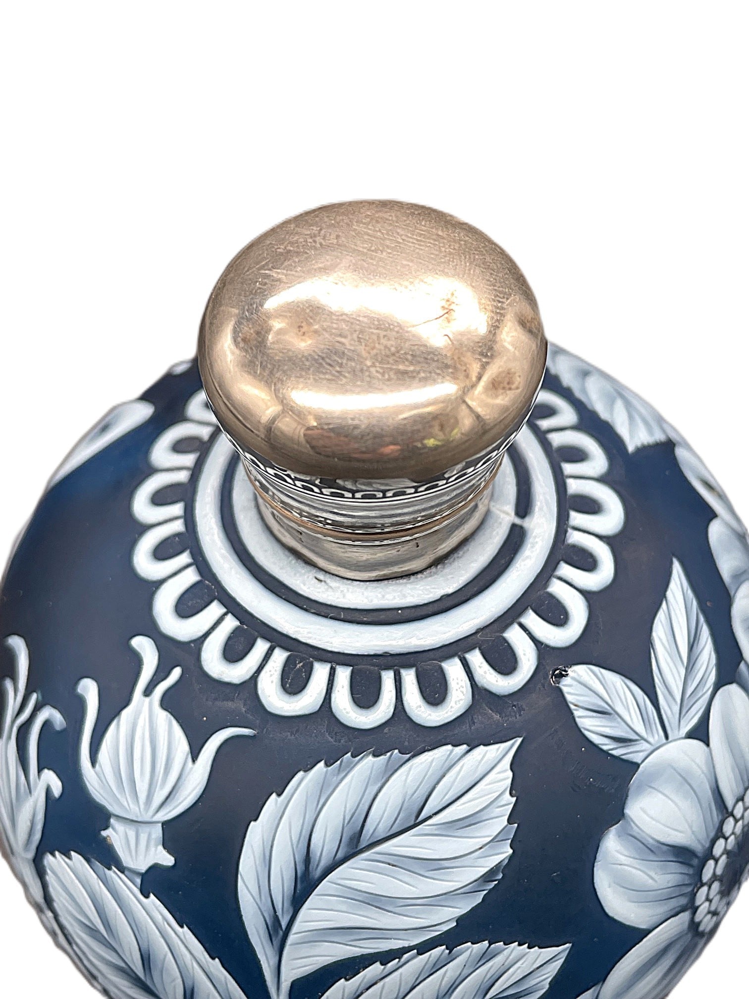 Thomas Webb Cameo Glass Scent Bottle: Title: Thomas Webb Cameo Glass Scent Bottle Description: Thomas Webb cameo glass scent bottle, white on blue background. Decorated with plants and a butterfly. Silver gilt mount carri