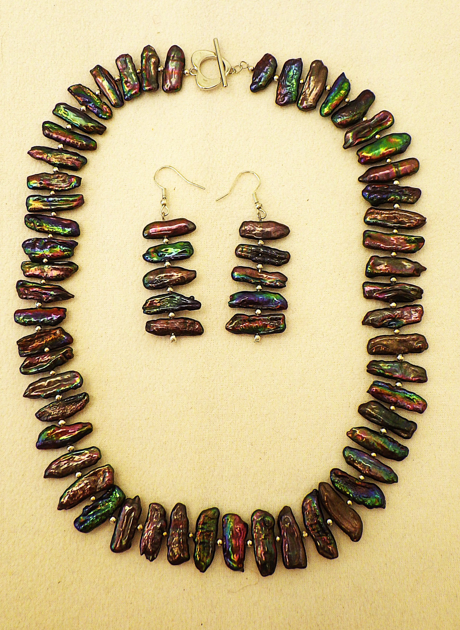 Exceptional natural black BIWA pearl necklace & earrings set: Title: Exceptional natural black BIWA pearl necklace & earrings set Description: An exceptional natural black elongate iridescent pearl (often called BIWA pearls) necklace and earrings set.