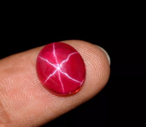 Two six ray star ruby cabochons: Title: Two six ray star ruby cabochons Description: Two oval, six ray Lindy star sapphire ruby cabochons with beautiful colour saturation, substantial size 12,1 x 10.0 x 4.9 mm and 11.8 x 10.0 x 4.4