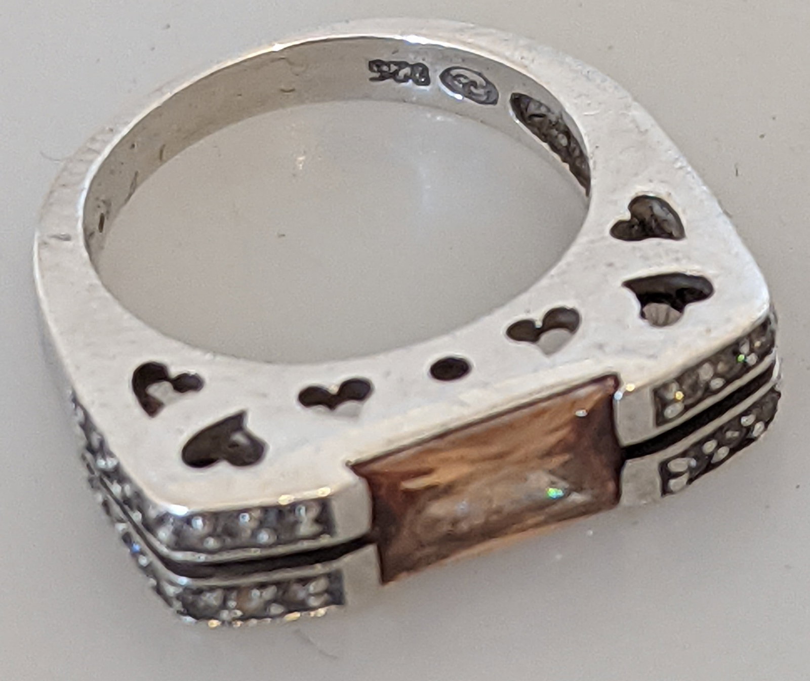 Stunning Sterling Silver 925 Ring with Champagne Baguette Stone: Title: Stunning Sterling Silver 925 Ring with Champagne Baguette Stone Description: A beautiful statement ring combining elegance and unique design Key Features: • Metal: Genuine Sterling