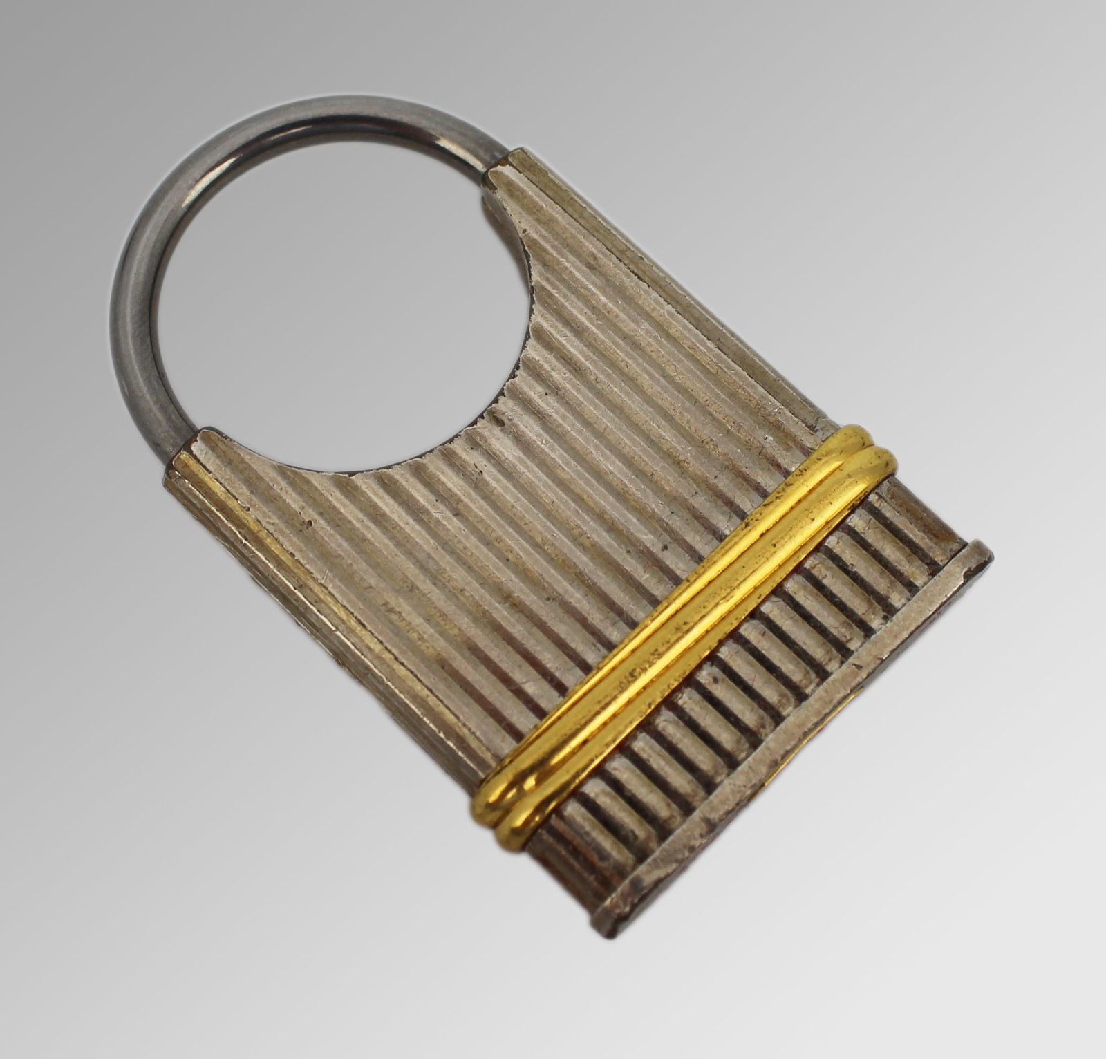 Title: Cartier Must de Cartier Padlock Form Keyring Description: Cartier Must de Cartier Padlock: Title: Cartier Must de Cartier Padlock Form Keyring Description: Cartier Must de Cartier Padlock Keyring A stylish and functional keyring from the Must de Cartier collection, designed in the form of