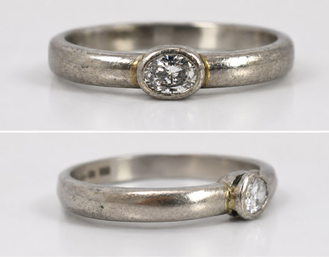 Title: Vintage Oval Diamond Platinum Ring Description: Vintage Oval Diamond Platinum Ring Vintage: Title: Vintage Oval Diamond Platinum Ring Description: Vintage Oval Diamond Platinum Ring Vintage 20th c. Set with oval diamond 0.20 carat Platinum shank, fully hallmarked. Weight 4.7 g Ring size P