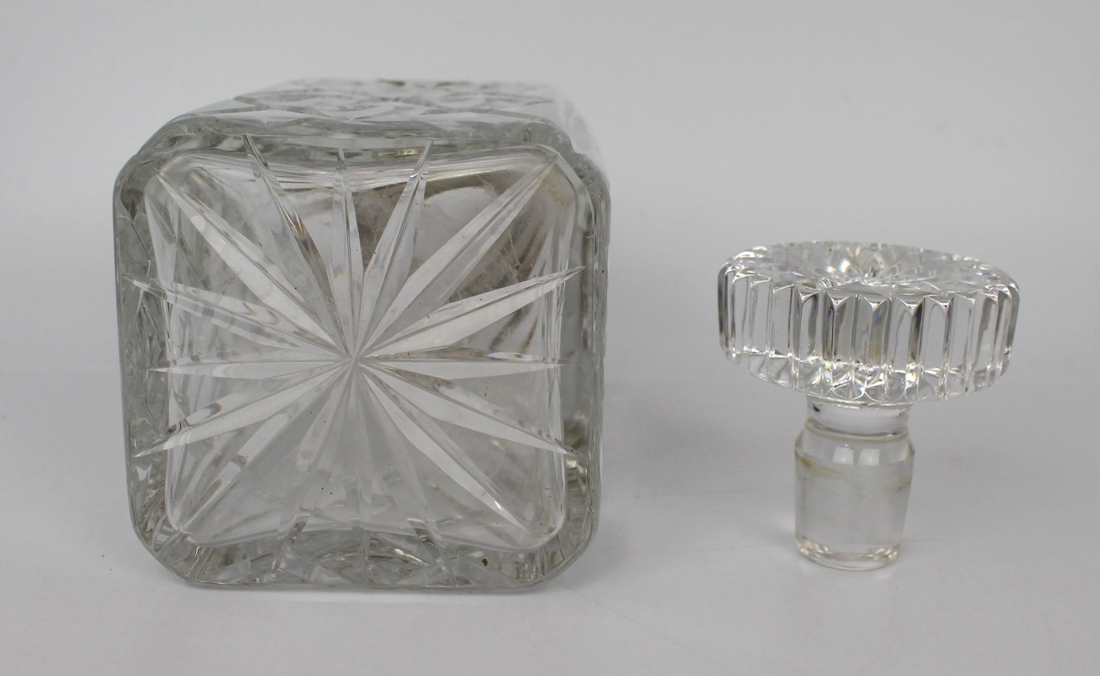 Title: Cut Glass Silver Mounted Decanter Description: Cut Glass Silver Mounted Decanter. Measures 10 - 9