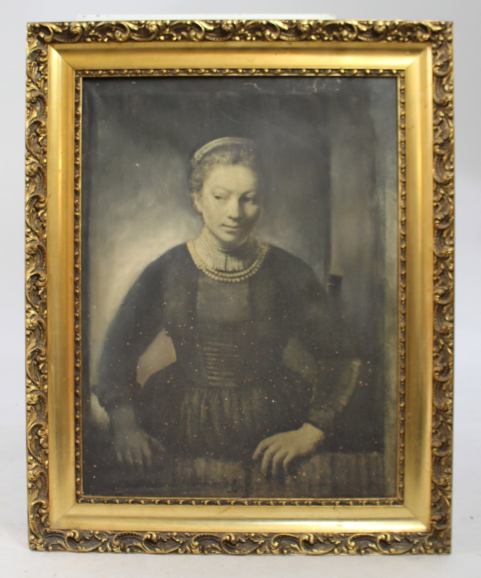 Title: Rembrandt print on canvas Description: Rembrandt print on canvas. Set in heavy gilt frame.: Title: Rembrandt print on canvas Description: Rembrandt print on canvas. Set in heavy gilt frame. Frame measures 59 x 74 .5 cm. Some paint speckling and ripples to canvas. Frame in good condition.