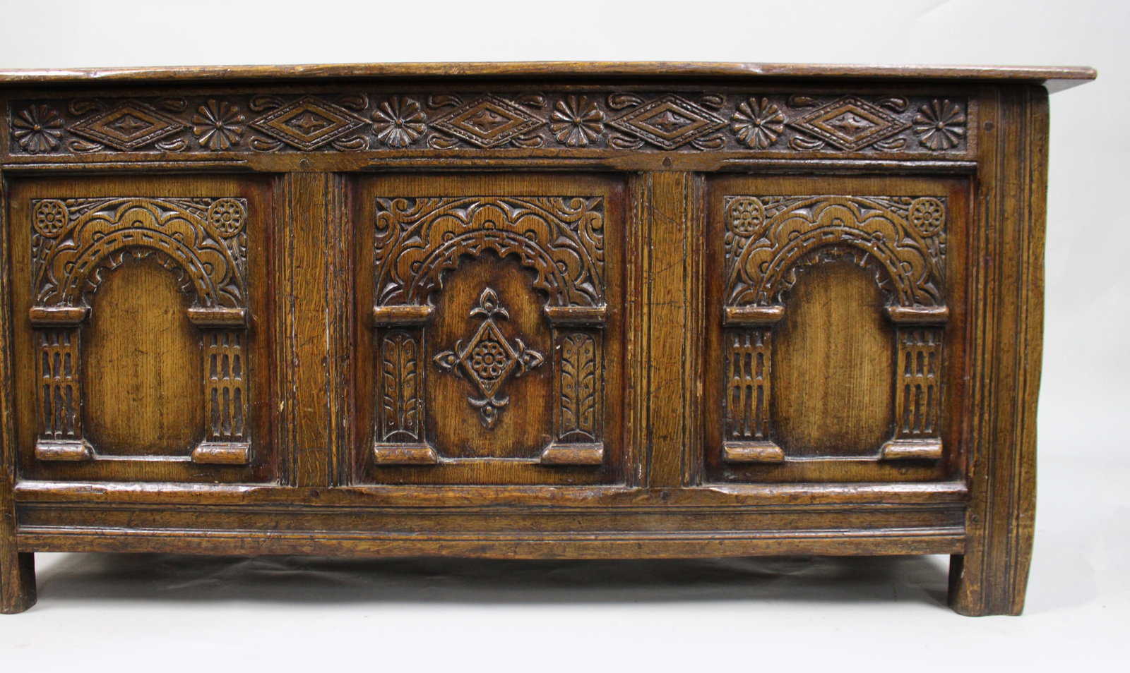 Title: Heavily Carved Oak Coffer in the Jacobean Taste Description: Mid-20th Century English - 12