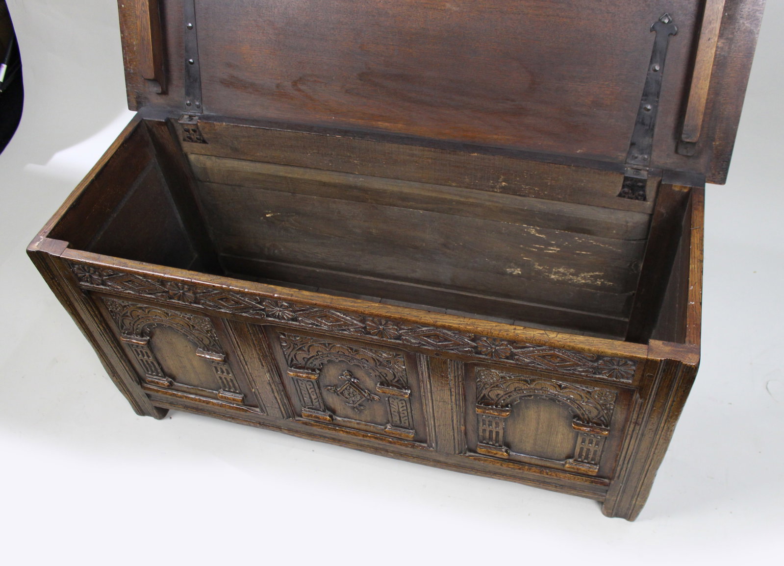 Title: Heavily Carved Oak Coffer in the Jacobean Taste Description: Mid-20th Century English - 16