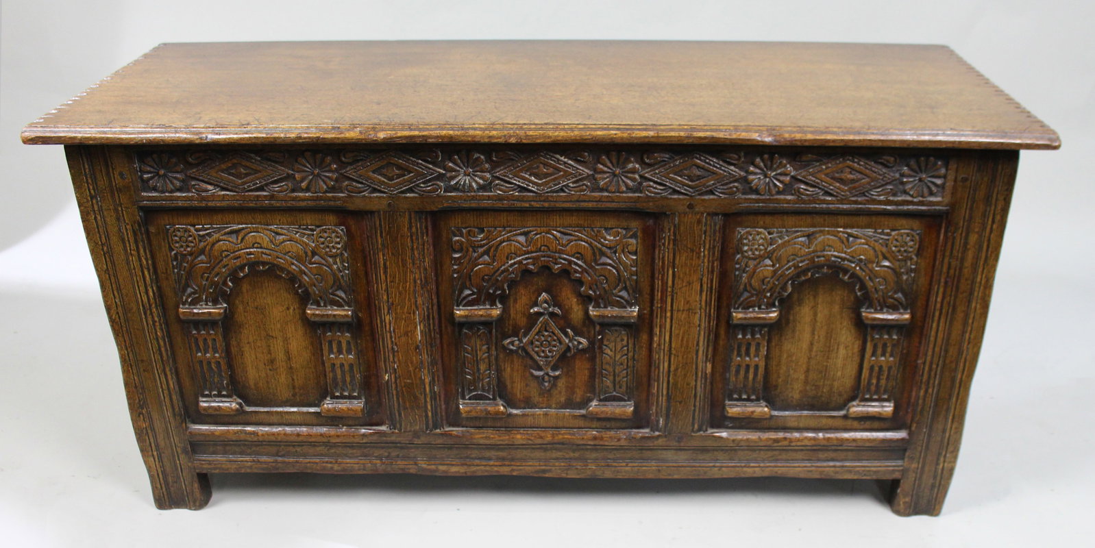 Title: Heavily Carved Oak Coffer in the Jacobean Taste Description: Mid-20th Century English - 2