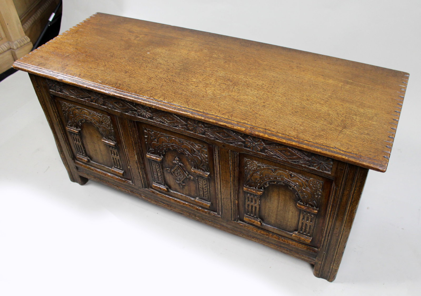 Title: Heavily Carved Oak Coffer in the Jacobean Taste Description: Mid-20th Century English - 3