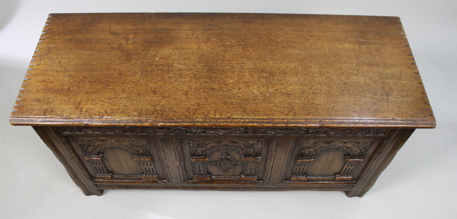 Title: Heavily Carved Oak Coffer in the Jacobean Taste Description: Mid-20th Century English - 9